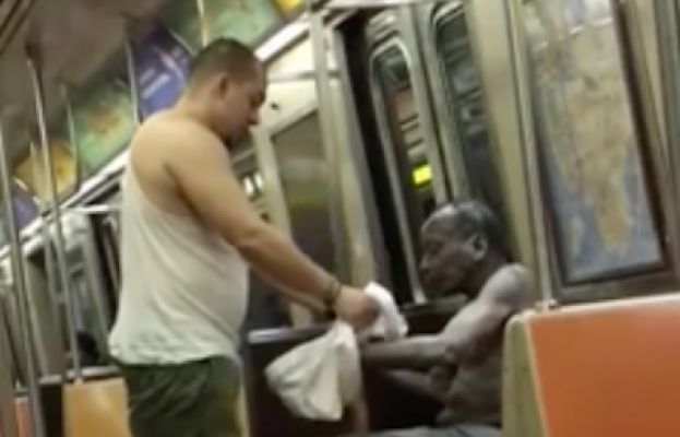 Guy sacrificed the clothes off his back to keep a homeless man from getting cold on the subway!